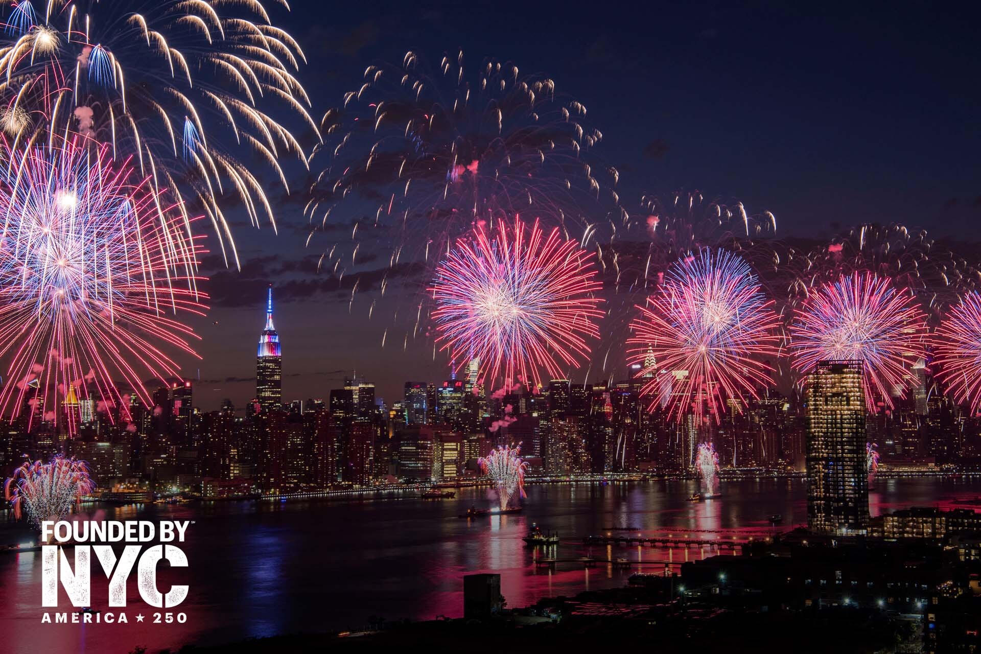 New York City skyline at night with fireworks